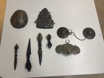 Four Tibetan bronze and wooden phurbas, a 'kapala' or skull-bowl, a pair of brass tingsha and two silver ornaments,  19th C.
