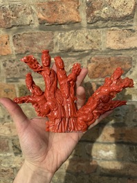 A Chinese red coral group of ladies with playing children on wooden stand, 19/20th C.