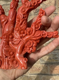 A Chinese red coral group of ladies with playing children on wooden stand, 19/20th C.