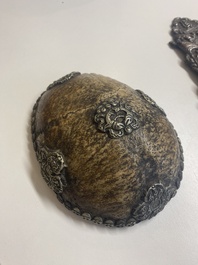 Four Tibetan bronze and wooden phurbas, a 'kapala' or skull-bowl, a pair of brass tingsha and two silver ornaments,  19th C.