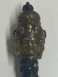 Four Tibetan bronze and wooden phurbas, a 'kapala' or skull-bowl, a pair of brass tingsha and two silver ornaments,  19th C.