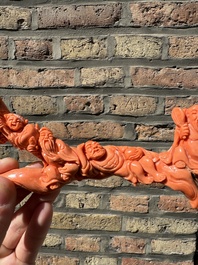 A Chinese red coral 'Eight Immortals' group on wooden stand, 19/20th C.
