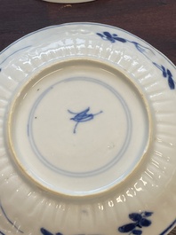 A collection of 15 Chinese blue and white cups and 19 saucers, Kangxi/Yongzheng