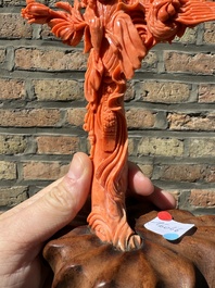 A Chinese red coral figure of Xiwangmu on wooden stand, 19/20th C.