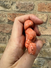 A set of seven Chinese red coral figures on wooden stand, 19/20th C.