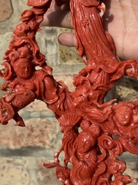 A large Chinese red coral group of female deities among clouds on wooden stand, 19/20th C.