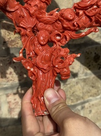 A large Chinese red coral group of female deities among clouds on wooden stand, 19/20th C.