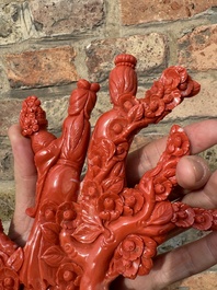 A Chinese red coral group of ladies with playing children on wooden stand, 19/20th C.