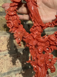 A large Chinese red coral group of female deities among clouds on wooden stand, 19/20th C.