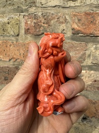A set of seven Chinese red coral figures on wooden stand, 19/20th C.