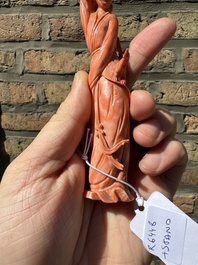 A Chinese red coral figure of a lady holding a fan and a phoenix, 19/20th C.