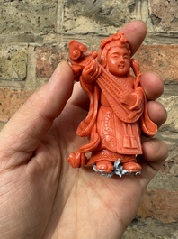 A set of seven Chinese red coral figures on wooden stand, 19/20th C.