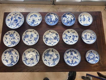 A collection of 15 Chinese blue and white cups and 19 saucers, Kangxi/Yongzheng