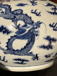 A Chinese blue and white bottle vase with dragons among flames and clouds, 19th C.