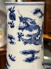 A Chinese blue and white bottle vase with dragons among flames and clouds, 19th C.