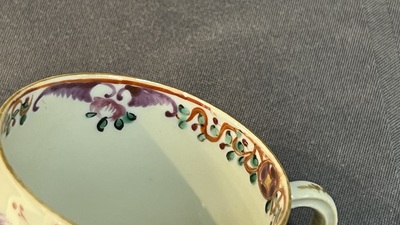 Four Chinese famille rose cups and saucers and a sugar bowl with design of two horses, Qianlong