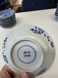 Eleven Chinese blue and white 'crab and fish' cups and saucers, Kangxi mark, Guangxu