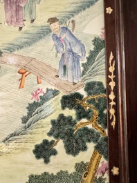 A Chinese famille rose 'eight immortals' plaque in a wooden frame, 18/19th C.