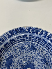 Eleven Chinese blue and white 'crab and fish' cups and saucers, Kangxi mark, Guangxu