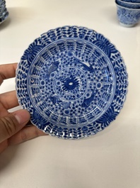 Eleven Chinese blue and white 'crab and fish' cups and saucers, Kangxi mark, Guangxu