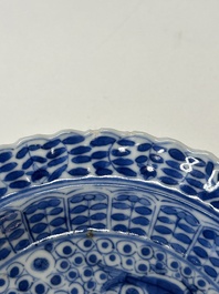 Eleven Chinese blue and white 'crab and fish' cups and saucers, Kangxi mark, Guangxu