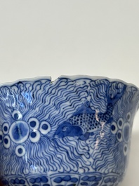 Eleven Chinese blue and white 'crab and fish' cups and saucers, Kangxi mark, Guangxu