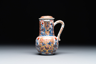 A Chinese English-decorated blue and white jug and cover, Kangxi