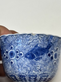 Eleven Chinese blue and white 'crab and fish' cups and saucers, Kangxi mark, Guangxu