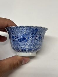 Eleven Chinese blue and white 'crab and fish' cups and saucers, Kangxi mark, Guangxu