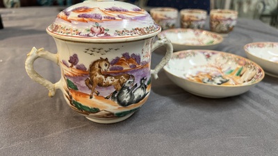 Four Chinese famille rose cups and saucers and a sugar bowl with design of two horses, Qianlong