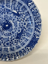 Eleven Chinese blue and white 'crab and fish' cups and saucers, Kangxi mark, Guangxu