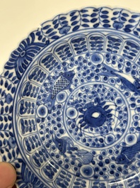 Eleven Chinese blue and white 'crab and fish' cups and saucers, Kangxi mark, Guangxu