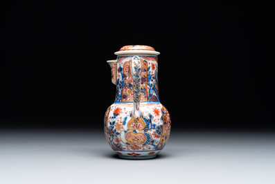 A Chinese English-decorated blue and white jug and cover, Kangxi