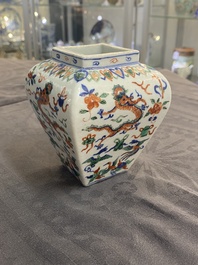A Chinese cream-glazed vase and two 'dragon' vases, Jiajing and Wanli mark, 19/20th C.