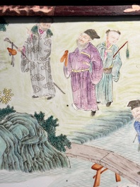 A Chinese famille rose 'eight immortals' plaque in a wooden frame, 18/19th C.
