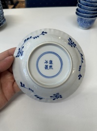 Eleven Chinese blue and white 'crab and fish' cups and saucers, Kangxi mark, Guangxu
