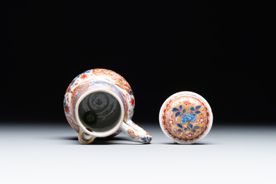 A Chinese English-decorated blue and white jug and cover, Kangxi