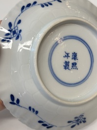 Eleven Chinese blue and white 'crab and fish' cups and saucers, Kangxi mark, Guangxu