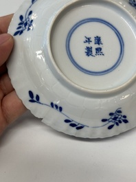 Eleven Chinese blue and white 'crab and fish' cups and saucers, Kangxi mark, Guangxu