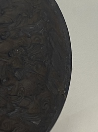 A Chinese huanghuali wooden brushpot and a melon-shaped lacquer box and cover with '18 Luohan' relief design, 19/20th C.