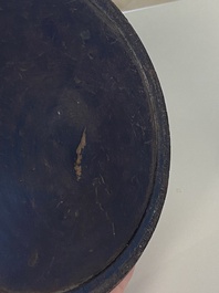 A Chinese huanghuali wooden brushpot and a melon-shaped lacquer box and cover with '18 Luohan' relief design, 19/20th C.
