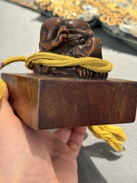 A Chinese sculpted hongmu wooden 'Jiaqing Yubi Zhibao 嘉慶御筆之寶' seal, 20th C.