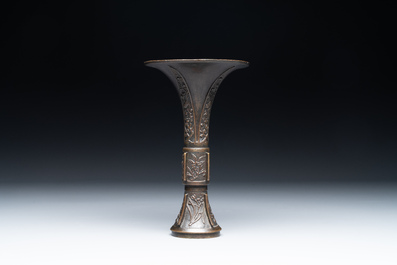 A fine and rare Chinese bronze vase with floral design in the style of Hu Wenming 胡文明, 'gu 觚', Ming