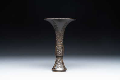 A fine and rare Chinese bronze vase with floral design in the style of Hu Wenming 胡文明, 'gu 觚', Ming