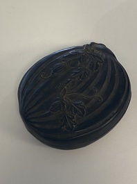 A Chinese huanghuali wooden brushpot and a melon-shaped lacquer box and cover with '18 Luohan' relief design, 19/20th C.