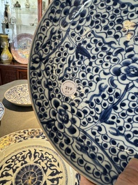Four Chinese blue and white dishes with floral design, Kangxi/Yongzheng