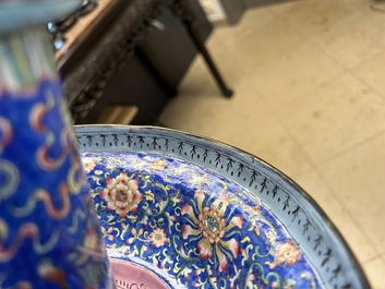 A large Chinese Canton enamel blue-ground 'shou' candlestick, Qianlong/Jiaqing