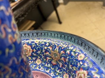 A large Chinese Canton enamel blue-ground 'shou' candlestick, Qianlong/Jiaqing