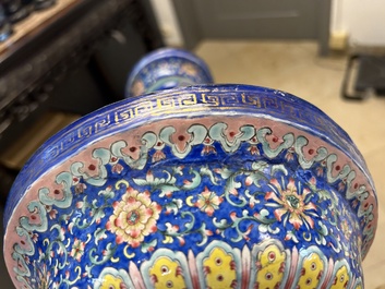 A large Chinese Canton enamel blue-ground 'shou' candlestick, Qianlong/Jiaqing