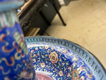A large Chinese Canton enamel blue-ground 'shou' candlestick, Qianlong/Jiaqing